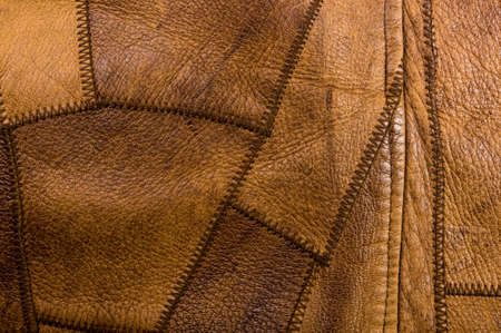 Old vintage genuine soft brown leather texture background, top layer with pores and scratches, macro, close-upの写真素材