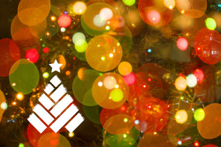 Christmas background-garlands with colorful lights on a decorated Christmas tree, bokeh, Happy New Year 2021 colored symbol and text in trendy flatten style design.の写真素材