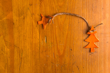 New Year Concept. Christmas decorations hand made from tangerine peel on wooden backgroundの写真素材