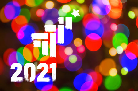 Christmas background-garlands with colorful lights on a decorated Christmas tree, bokeh, Happy New Year 2021 colored symbol and text in trendy flatten style design for seasonal holidays flyers, greetings and invitations cards and christmas themed congratulations and bannersの写真素材