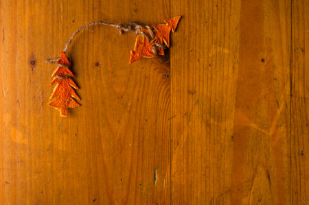 New Year Concept. Christmas decorations hand made from tangerine peel on wooden backgroundの写真素材