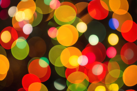 Christmas background-garlands with colorful lights on a decorated Christmas tree, bokeh, close-upの写真素材