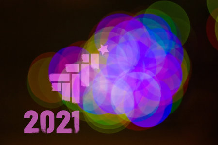Christmas background-garlands with colorful lights on a decorated Christmas tree, bokeh, close-upの写真素材