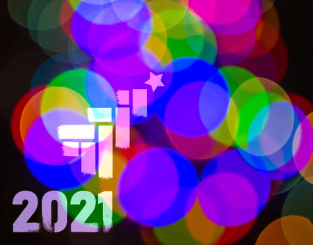 Christmas background-garlands with colorful lights on a decorated Christmas tree, bokeh, close-up