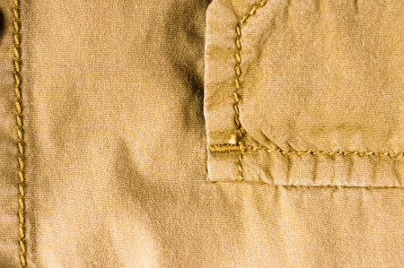 clothing items washed cotton fabric texture with seams, clasps, buttons and rivets, macro, close-upの写真素材