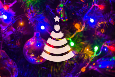 Christmas background-garlands with colorful lights on a decorated Christmas tree, bokeh, blurred, close-upの写真素材