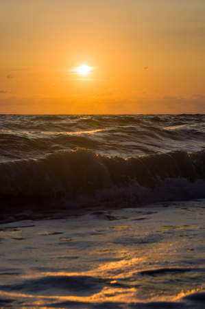 Amazing sea sunset, the sun, waves, cloudsの写真素材