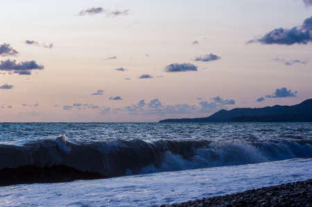 Amazing sea sunset, waves and cloudsの写真素材