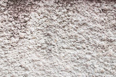 One of rought wall made from cement and made it with fine grain when it was dried.の写真素材