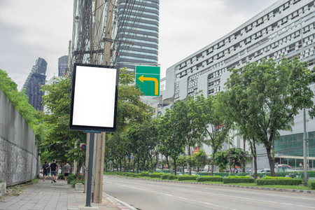 Blank billboard on the road in Thailand Blank billboard with copy space for text or content. Simulate an empty billboard in a big city.の写真素材