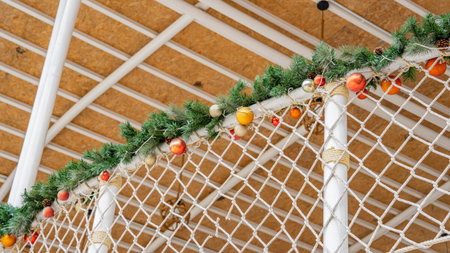 Buildings used for recreation Decorate the fence with white netting and Christmas pine. Light brown thatched walls Focus on nature See a bird's-eye view. Can be used as a backgrounの写真素材