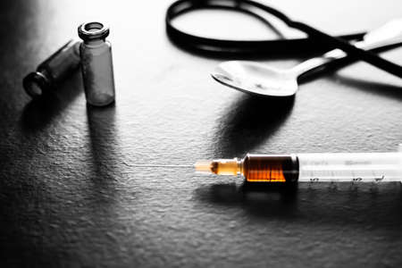 Heroin in syringe. narcotics, dangerous drug destroy lungs, suffer from severe dysentery. Substance Abuse, drug addiction and crime concept.の写真素材