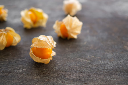 Cape gooseberry or physalis minima on wood background. Tropical fruit and food for health concept.の写真素材