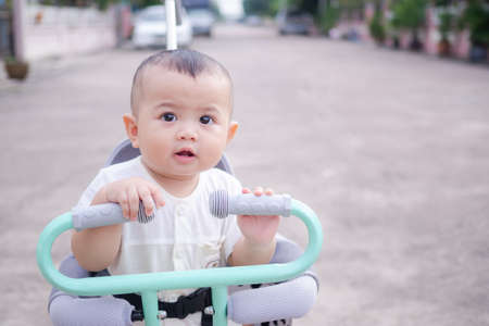Portrait cute child little boy 9 months smiling on blur background. baby concept.の写真素材