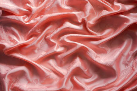 Luxuriors satin fabric or silk abstract background. of texture and pattern of colorful orange mess...