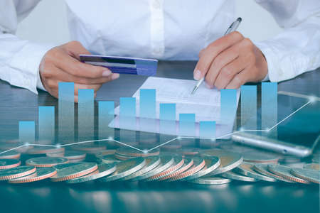double exposure of staff woman holding pen on book bank and credit card, smartphone, stack coin....