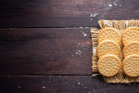 Digestive biscuits on wooden black background. flat lay with copy space for add text or products in...