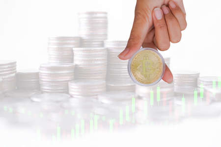 Hand woman holding bit coin with graph stock market and stack coin. double exposure image. planing...