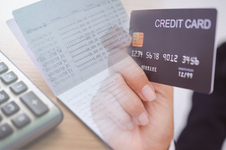Double exposure hand woman holding credit card with bookbank and caculator. for payment,  E- commerce, Shopping online or M banking. finance for invesment concept.の写真素材