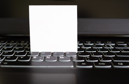 Mock up paper on keyboard. you can add text or message for presentation. business office or work...