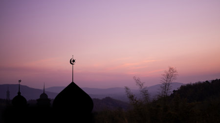 Ramadan, Eid ai-fitr,New year Muharram islamic religion Symbols with Mosques Dome silhouette on dark red and twilight sky in night sunset. arabic,Eid al-adha,mubarak  Muslim concept.の写真素材