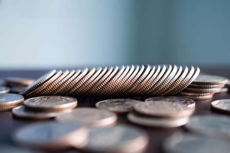 Stack coin on wooden background. pile thai cash and blur floor bank account. plan investment income...