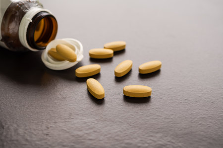 Vitamin C tablet with glass bottle on back wood background. supplement for antioxidant, beautiful skin, slow down aging, Strengthening the immune system. food for good health concept.の写真素材