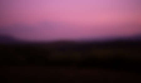 Blur Sunset on mountain and forest with pink sky background. beautiful evening outdoor nature with...