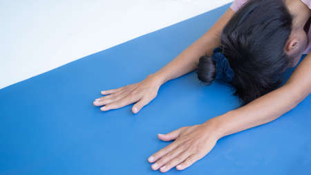 Balasana(Child's Pose) yoga. woman exercise at home in holidays. healthcare concept.