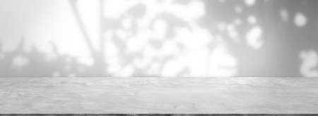 Backdrop empty gray cement wall room background with shadow. blank table studio interiors floor...