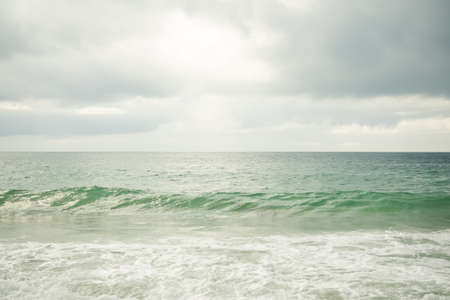 Blue Sea with White Cloud Sky Day Light Horizon view Background. Texture Surface Still Calm Peaceful of Water Ocean. Clean Clear Landscape. Tropical Travel Summer Holidays, Environment  Concept.の写真素材