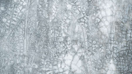 Gray cement background. interior old rough surface texture dark black white floor stone. dirty pattern floor wall and soft light material inside wallpaper backdrop. loft room ground raw house buiding.の写真素材