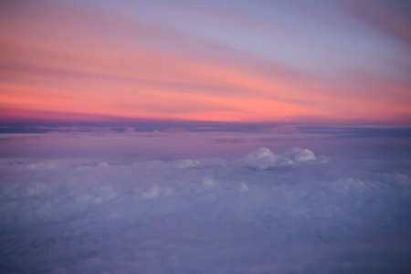 Sky Sunset Rainbow Soft Cloud blue orange background. beautiful pastel sunrise landscape backdrop.view sunlight sweet outdoor nature morning view from airplane. dreamy summer concept.の写真素材