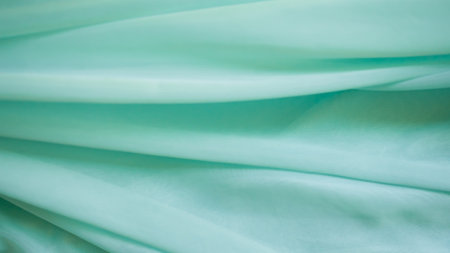 Green Color Cloth Pattern Background,Silk Wave Texture Design Holidays Travel Summer Card Banner,Light Gradient Fabric Smooth Shape Colorful,Abstract Luxury green Template Wallpaper.の写真素材