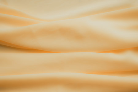 Yellow Color Autumn Cloth Pattern Background,Silk Wave Texture Design Backdrop,Card Poster or Banner,Light Gradient Fabric Smooth Shape Colorful,Abstract Luxury Golden Template Wallpaper,free space.の写真素材