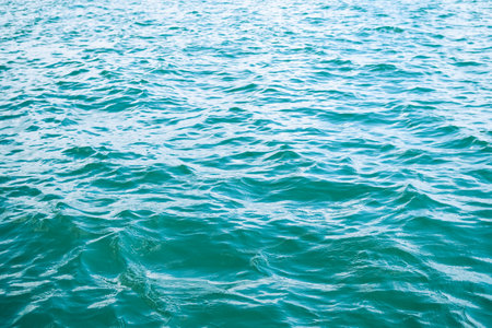 Texture White Wave on Blue Sea Water Background,Ocean Island Nature View Landscape Photography,for Tourist Vacation Travel Summer Tropical Holidays or Environment Concept,Top view from Coast Shore.の写真素材