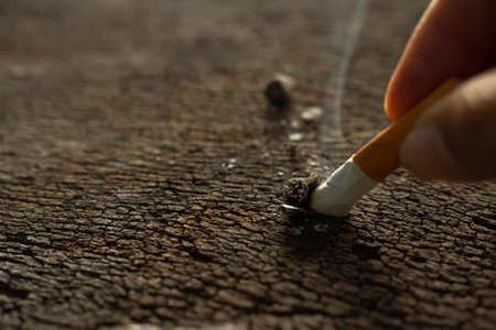 Cigarette with Finger on wood Background,Speed Drug,Substance Abuse,Addictive Habit-Forming Substance,Narcotic,illegal,Problem People concept.の写真素材