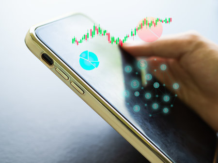 Candlestick Graph Chart on Moblie phone,Data Trade Forex Stock Market Accounting Exchange Analysis Digital Technology Business Finance,plan Investment Income for 2023 New Year.の写真素材