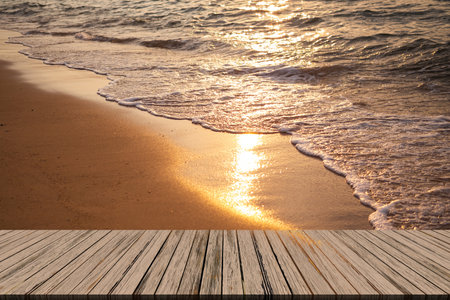 Empty Wooden Table on blur Sea with Sunset Background,Blank Counter on Water Ocean with sunrise at Coast,Mock Up Shore Seaside Island Nature Landscape Backdrop,Broken Heart or Tropical Summer Holidaysの写真素材
