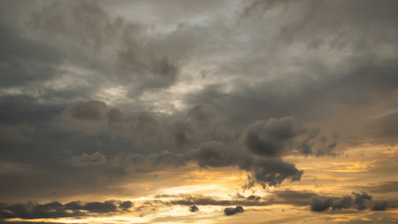 Golden Yellow Cloud Sky Sunset Blue Black Background,Scene Warm Colorful Orange Sunrise Summer Nature Landscape,Light Sunlight Weather Season beauty Horizontal Dusk,Sunny View Heaven Backdrop.の写真素材