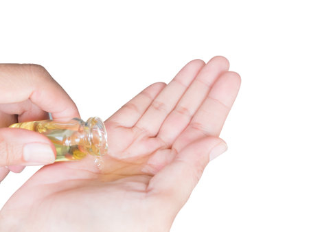 Massage Oil in Bottle into Palm Up Woman Isolated on Background,Aromatherapy Spa Set,Treatment Herb Nature for Beauty Salon,Medicine Hygiene Luxury in Holiday Relax and Good Health.の写真素材