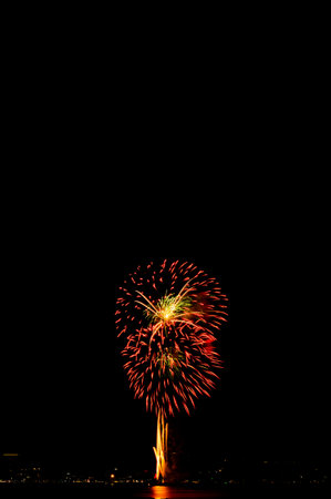 Firework on Black Dark Sky Background,Celebrate Party Merry Christmas and Happy New Year Festival,Light Bright Bokeh Gold Abstract Burst Fire Anniversary Birthday Holidays Wallpaper,Colorful Night.の写真素材