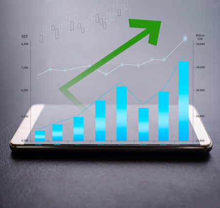 Mobile with Comparison bar chart numeric data and arrow uptrend, candlestick graph stock market. plan investment income and saving money growth in 2022 new year from trade forex. business or finance.の写真素材