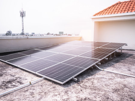 Solar Panels Solar Cells on Rooftop with Sun Overlight Day,New Design Plant Smart Solar System Micro Inverter Solar Panels Energy on Roof House,New Technology Electric for Eco Environment ecology.の写真素材