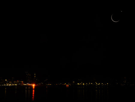 Mubarak Ramadan Month Muslim Islamic Moon Symbols,Crescent Moon and Star on Night Sky Dusk  Evening City and Sea Background,Twilight Free Space for Eid Al Adha,Eid Al Firr,Muharram Religious.の写真素材