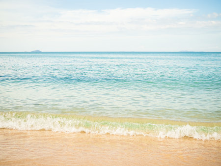 White Wave Sea Summer on Sand Beach with Blue Sky Background,Water Shore Beautiful for Tourism Relax Vacation Nature Tropical Travel in Holidays,Coast at Island with Cloud Sunlight.の写真素材