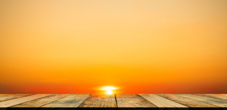 Light Evening on Wood Table,Shelf Place on Sunset Background,Dramatic Twilight Golden Nature Landscape,Horizon Backdrop,Card Poster for Tropical Travel Summer Holidays,Autumn,Broken Heart,Valentine.の写真素材
