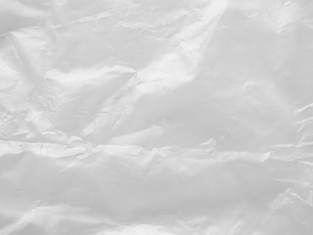 Abstract Texture Crumpled Polyethylene White Background,Pattern Crease Plastic Bag with Sun Shine Backdrop,Film Wrap Grunge,Overlay Poster Tape Card Foil Paper Sticker Mockup Pack Wrapper.の写真素材