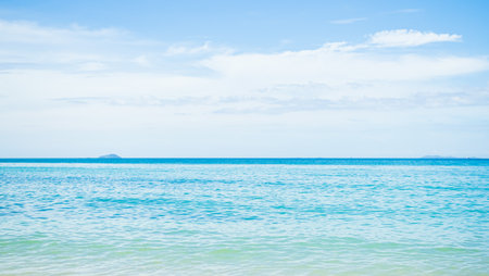 Blue Sea Shore Summer with Blue Sky Background,Cloud white Ocean Seascape,Water Wave,Beautiful Nature Coast Island,for Tourism Travel Vacation Tropical Holidays Concept.の写真素材
