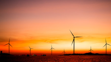 Windmill Sunset,Energy Turbine Wind Farm Generation Factory Farm,Plant Wind Turbine Power Sustainable Factory,Electric Industrial Alternative Renewable Energy Technology Mill,Environment.の写真素材